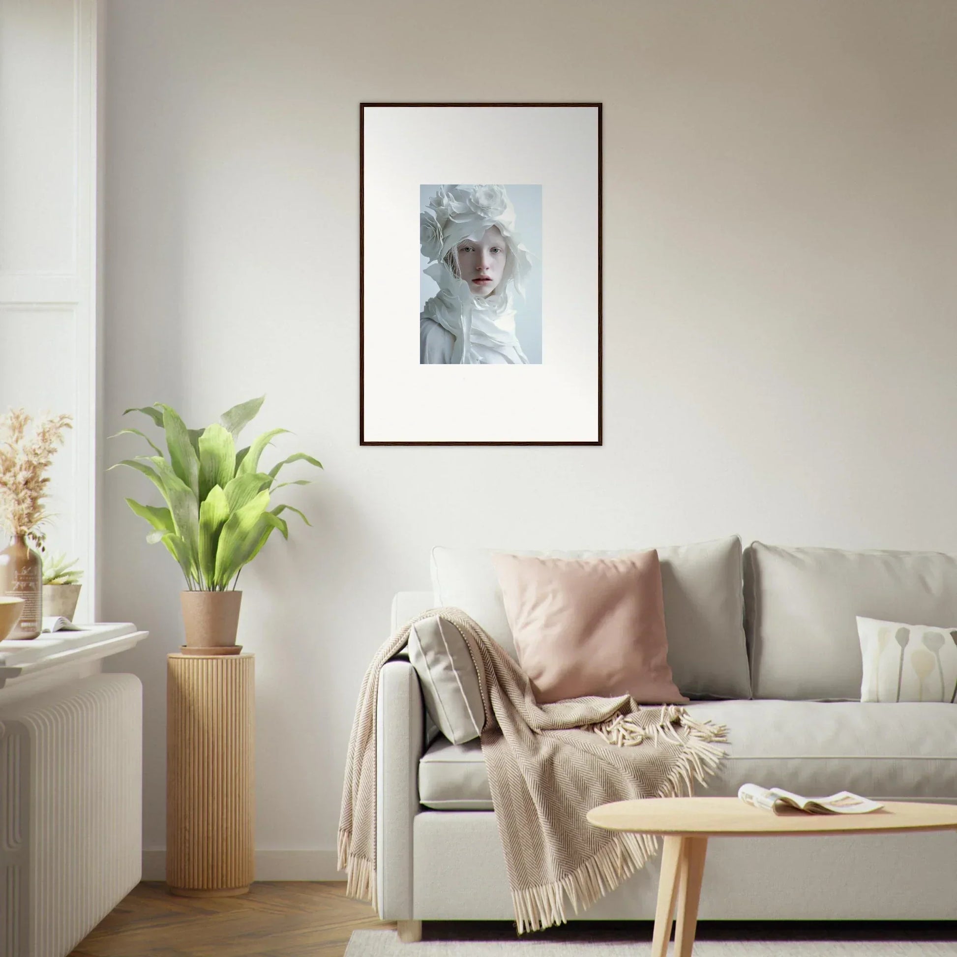 Framed wall art of a person with pale features and a white headdress for room decor