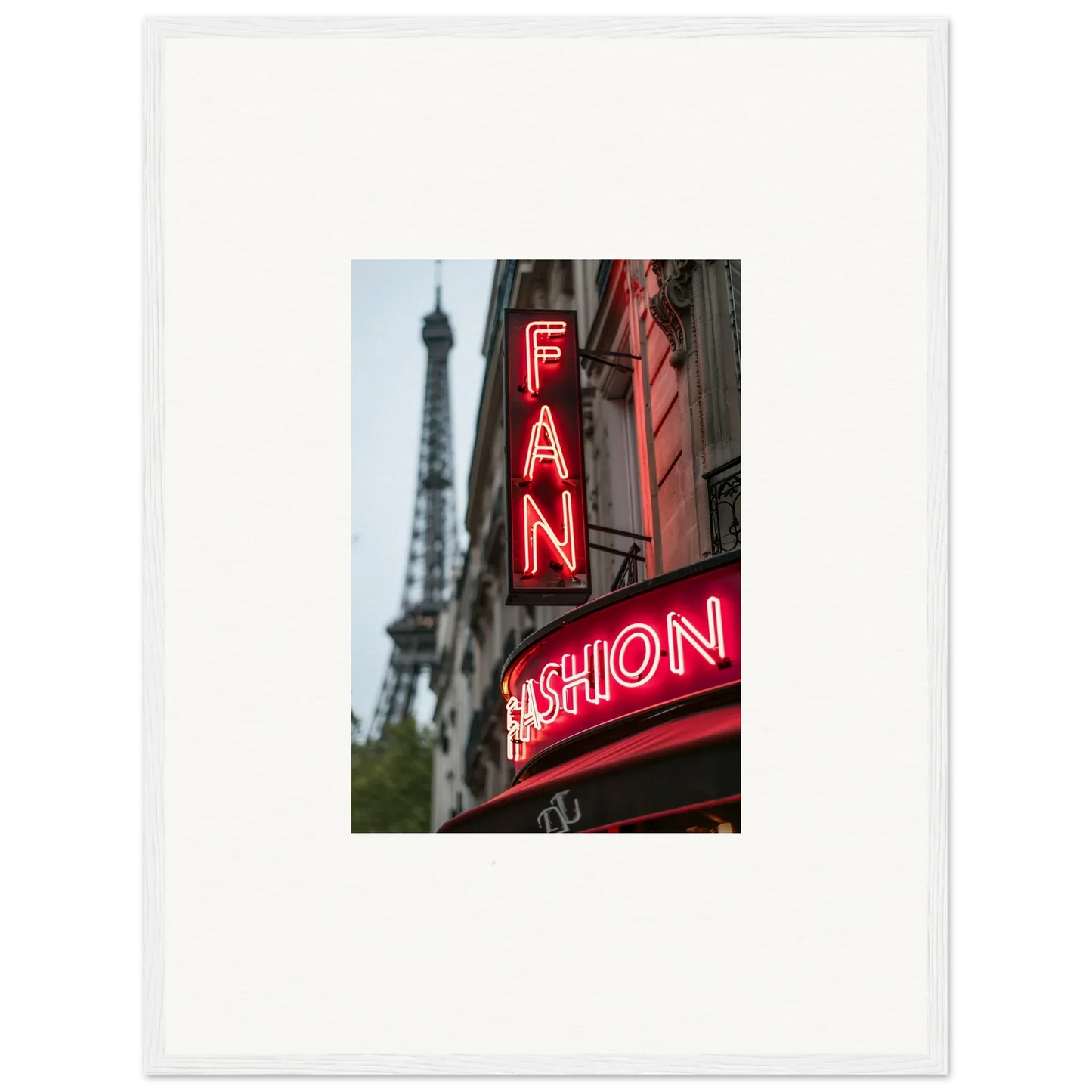 Framed wall art of a neon FAN FASHION sign with the Eiffel Tower in the background