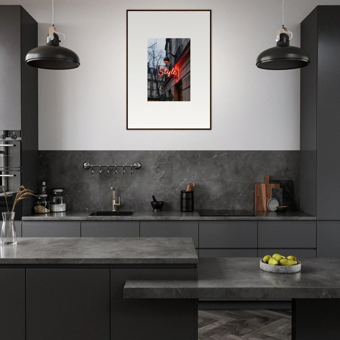 Modern kitchen featuring dark cabinetry, pendant lights, and canvas print decor