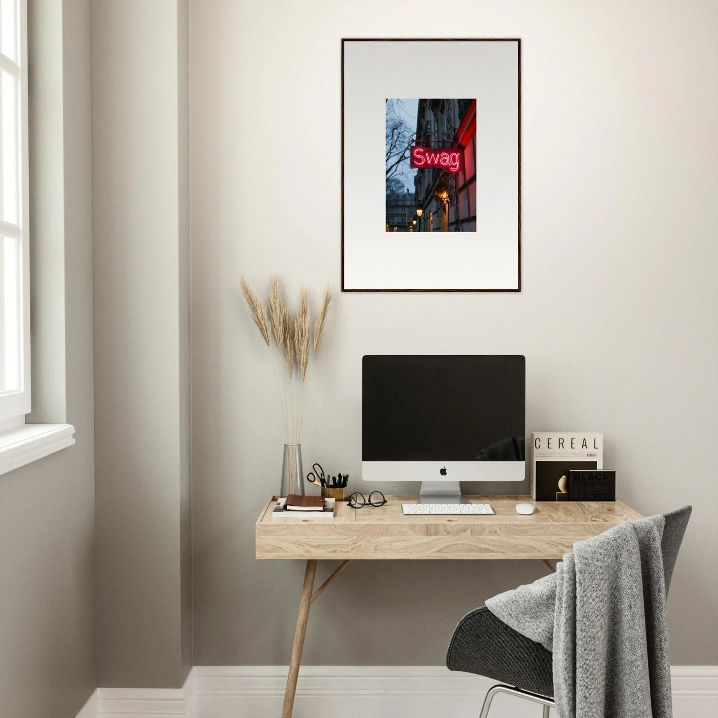 Minimalist home office with wooden desk, computer, and Night Dreams canvas print