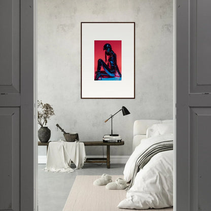 Framed wall art of a seated figure on vibrant red, perfect for Noir Mirage room decor