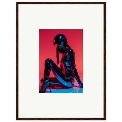 Framed wall art of a person in shiny black outfit on red, perfect for noir mirage room decor