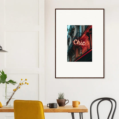 Framed wall art of a neon Chic sign in a Parisian Reverie building decor