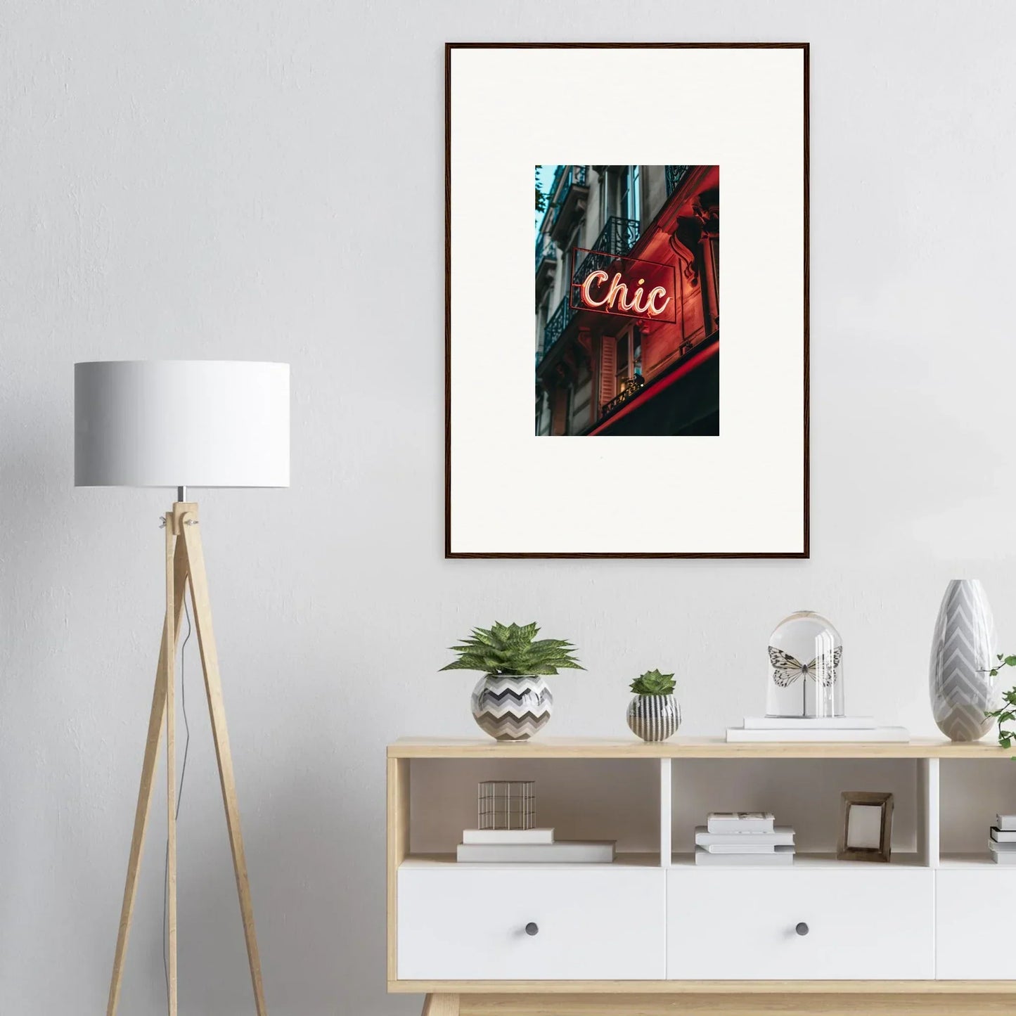 Framed wall art of a neon Chic sign in an urban setting for Parisian Reverie room decor