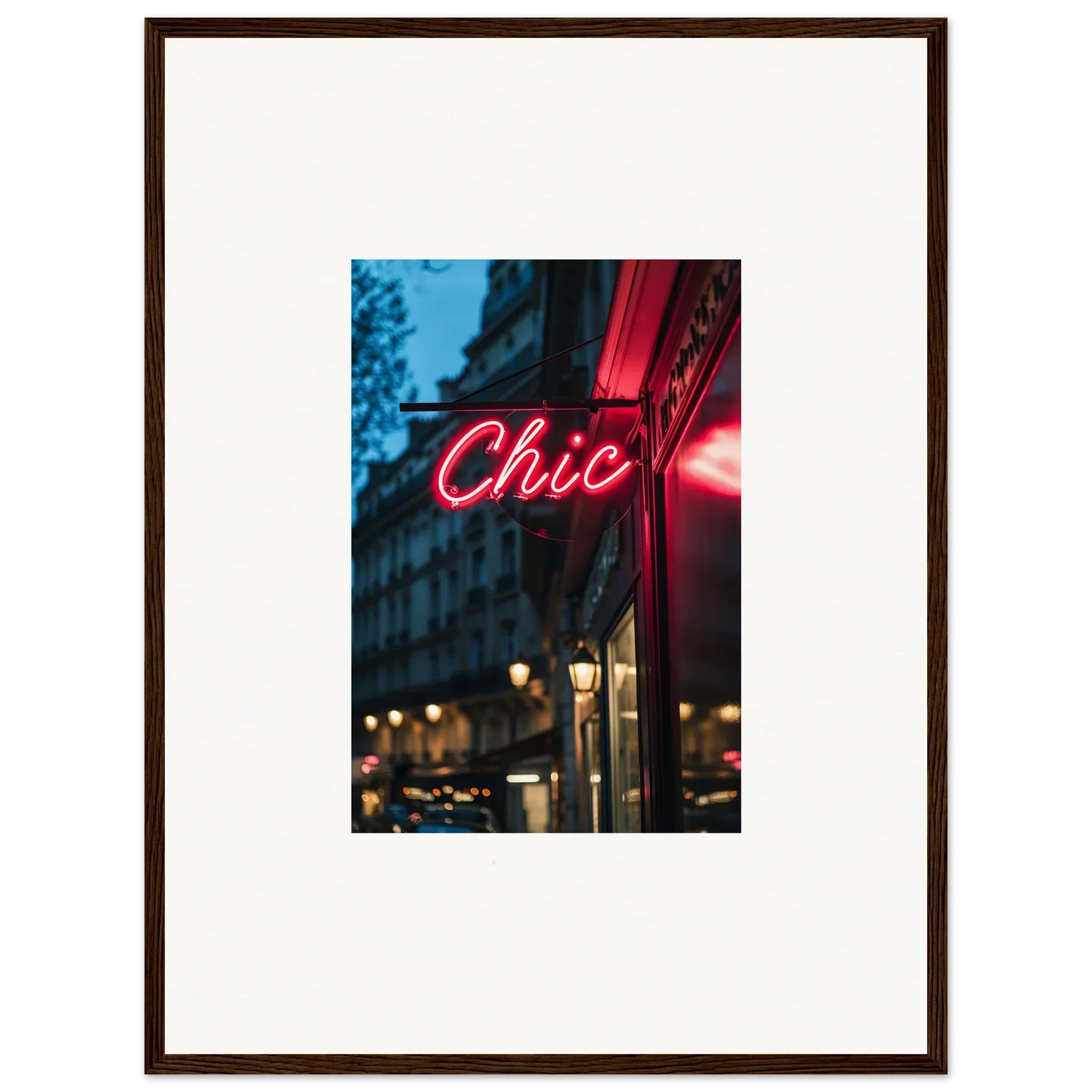 Framed neon Urban Whispers Chic sign glowing pink in a vibrant city night scene