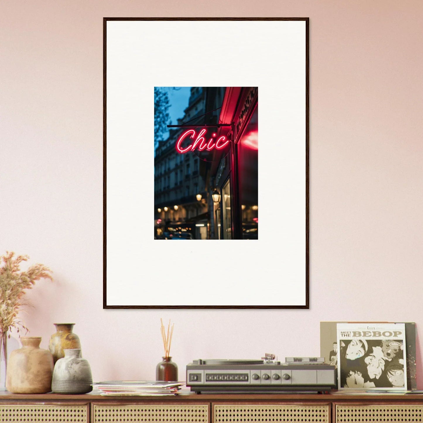 Framed photograph of a neon Chic sign in Neon Urban Whispers against a city night