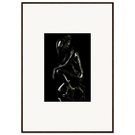 Dark, glossy sculpture of a crouching human figure.