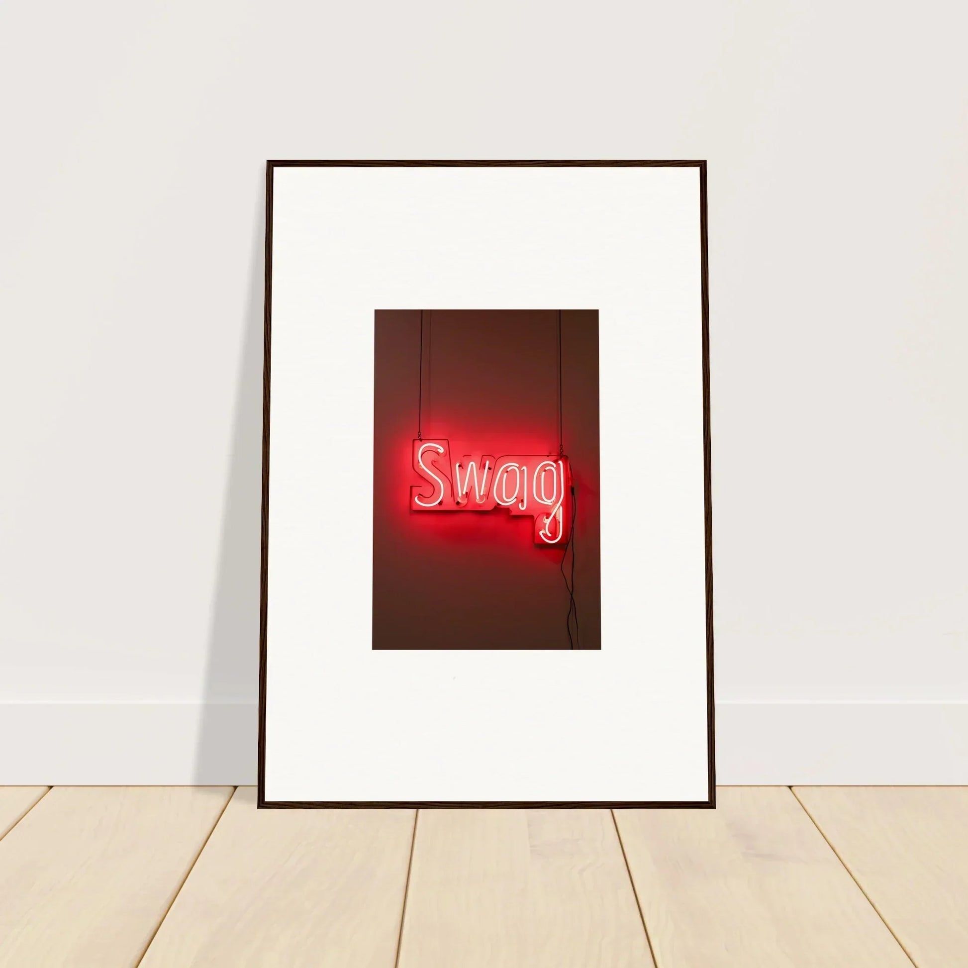 Framed wall art of a glowing red neon sign saying Swag for stylish room decor