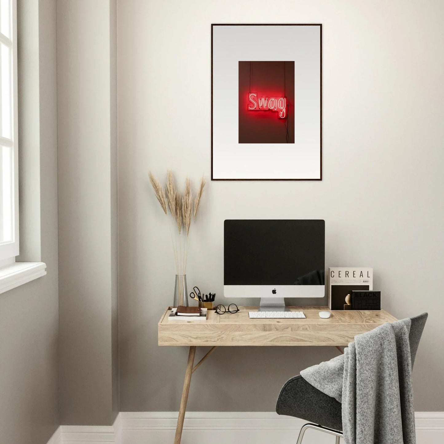 Minimalist wooden desk with computer and framed wall art for stylish room decor