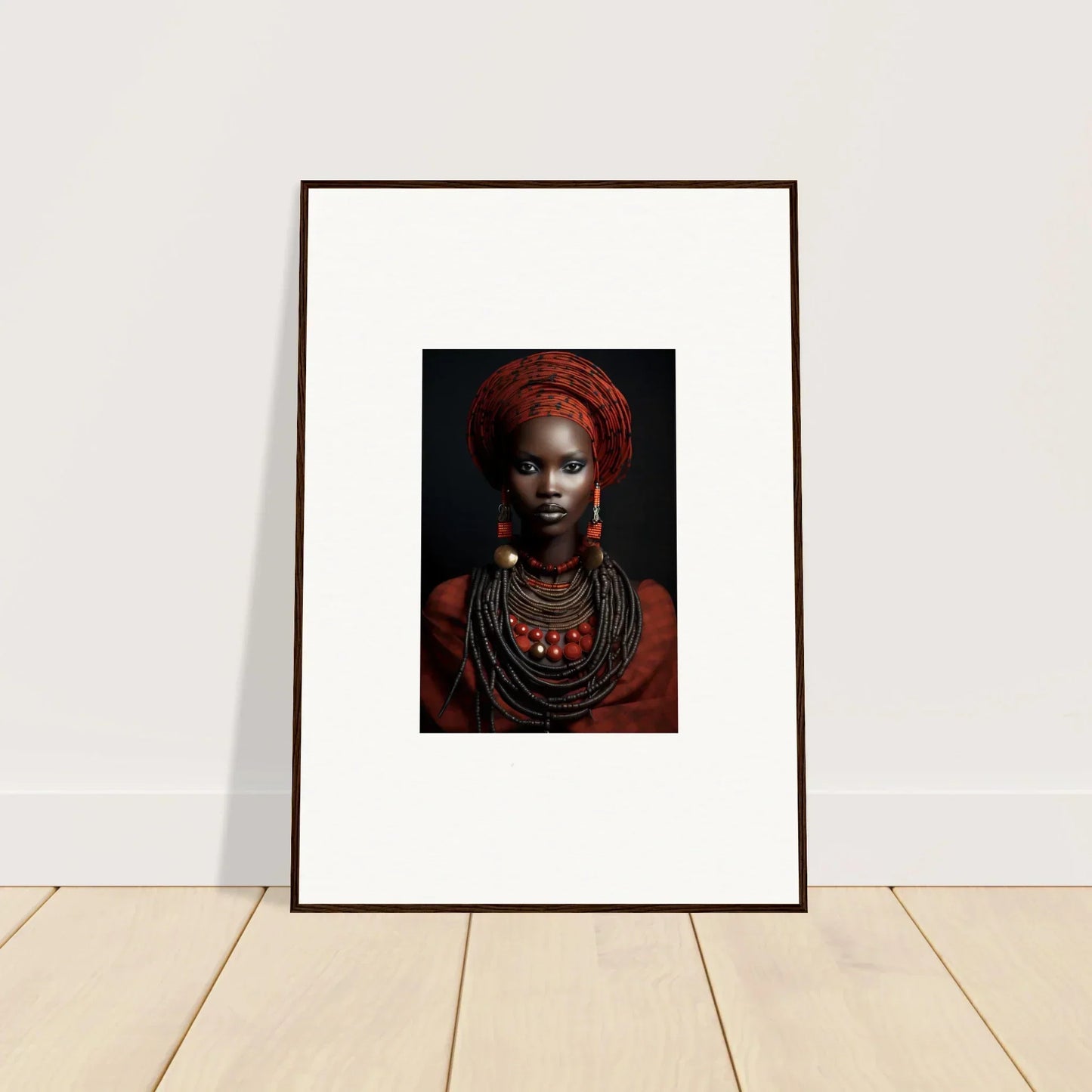 Framed wall art of traditional African jewelry and red head wrap from Ondine Atrium Accoutrements