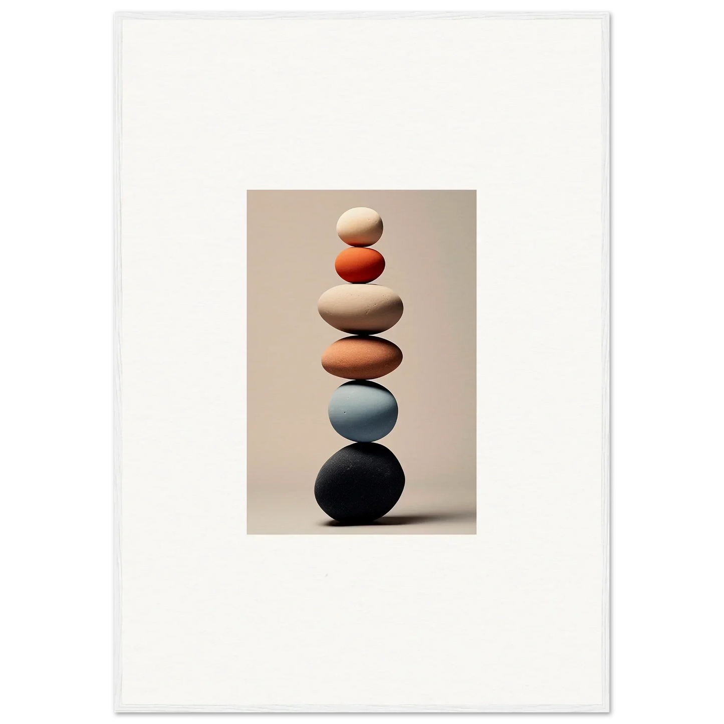 Balanced stack of smooth stones in earthy tones for the Orb Reverie special edition art™