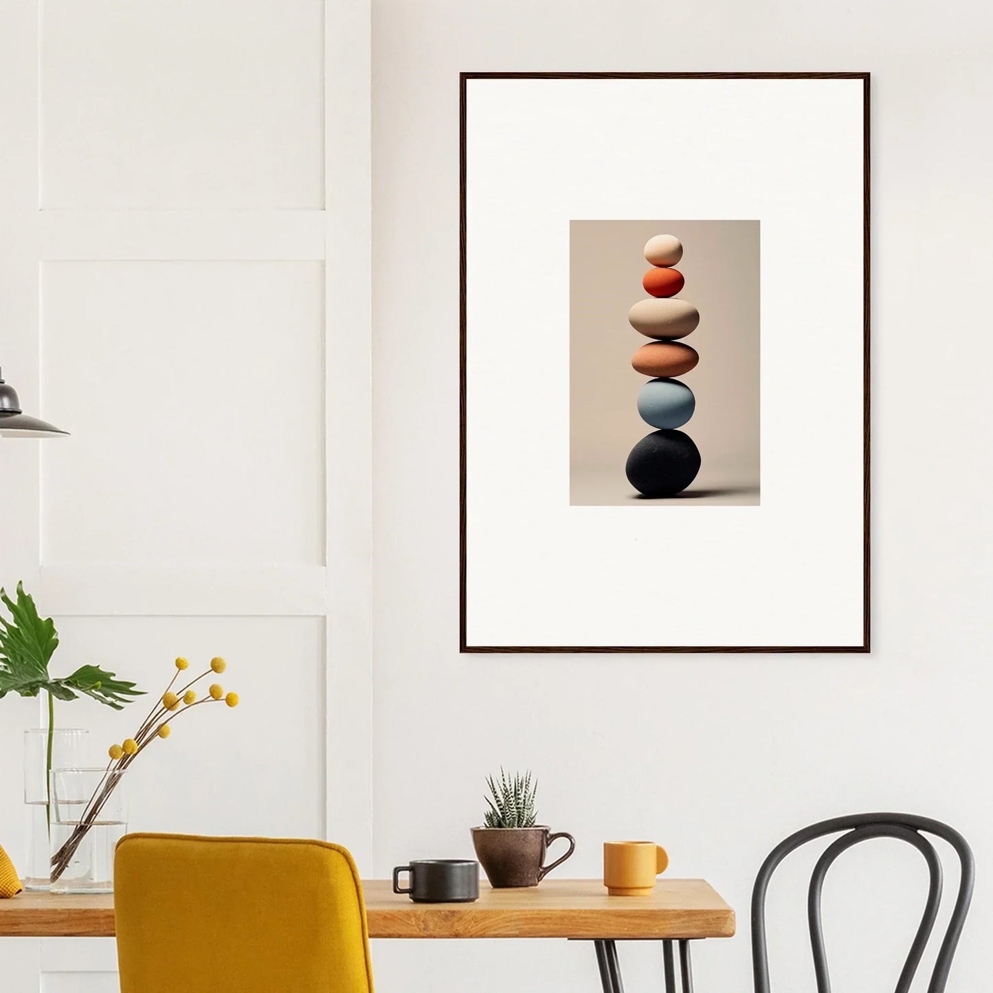 Framed Orb Reverie artwork of stacked earth-tone stones in a premium wall design