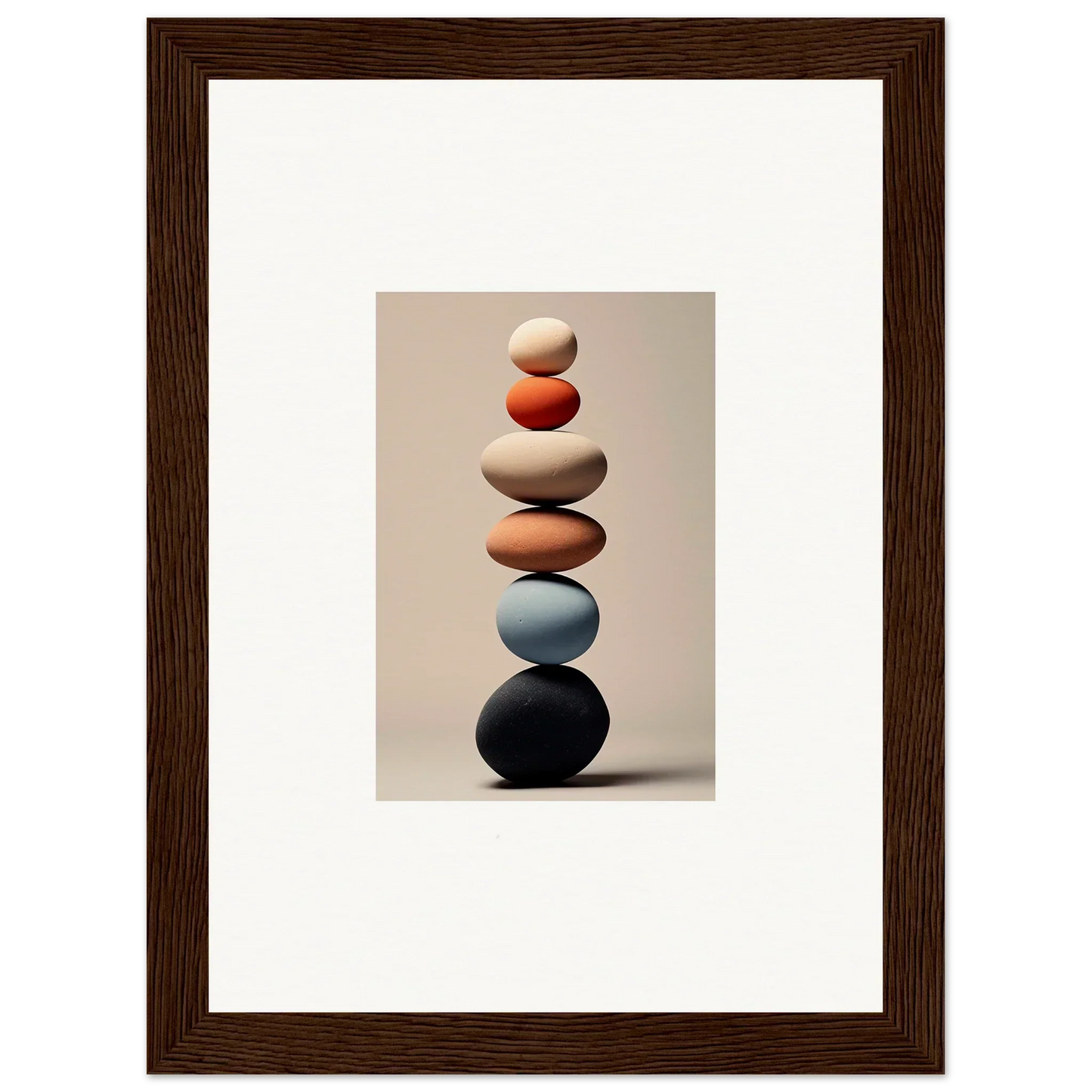 Balanced stack of smooth stones in white, orange, blue, and black for Orb Reverie