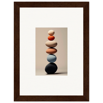 Balanced stack of smooth stones in white, orange, blue, and black for Orb Reverie