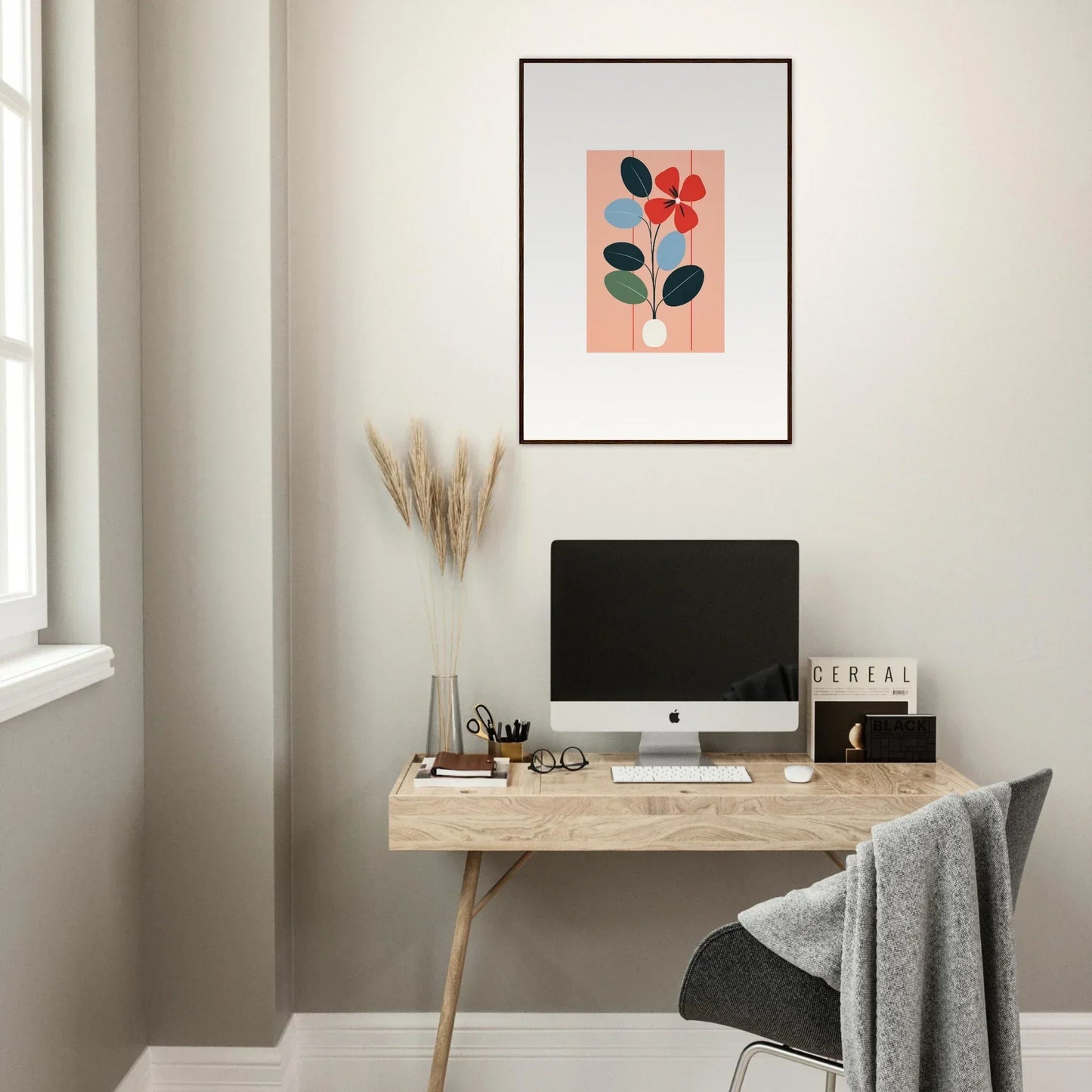 Minimalist workspace featuring wooden desk, computer, and Flora Imbibed wall art