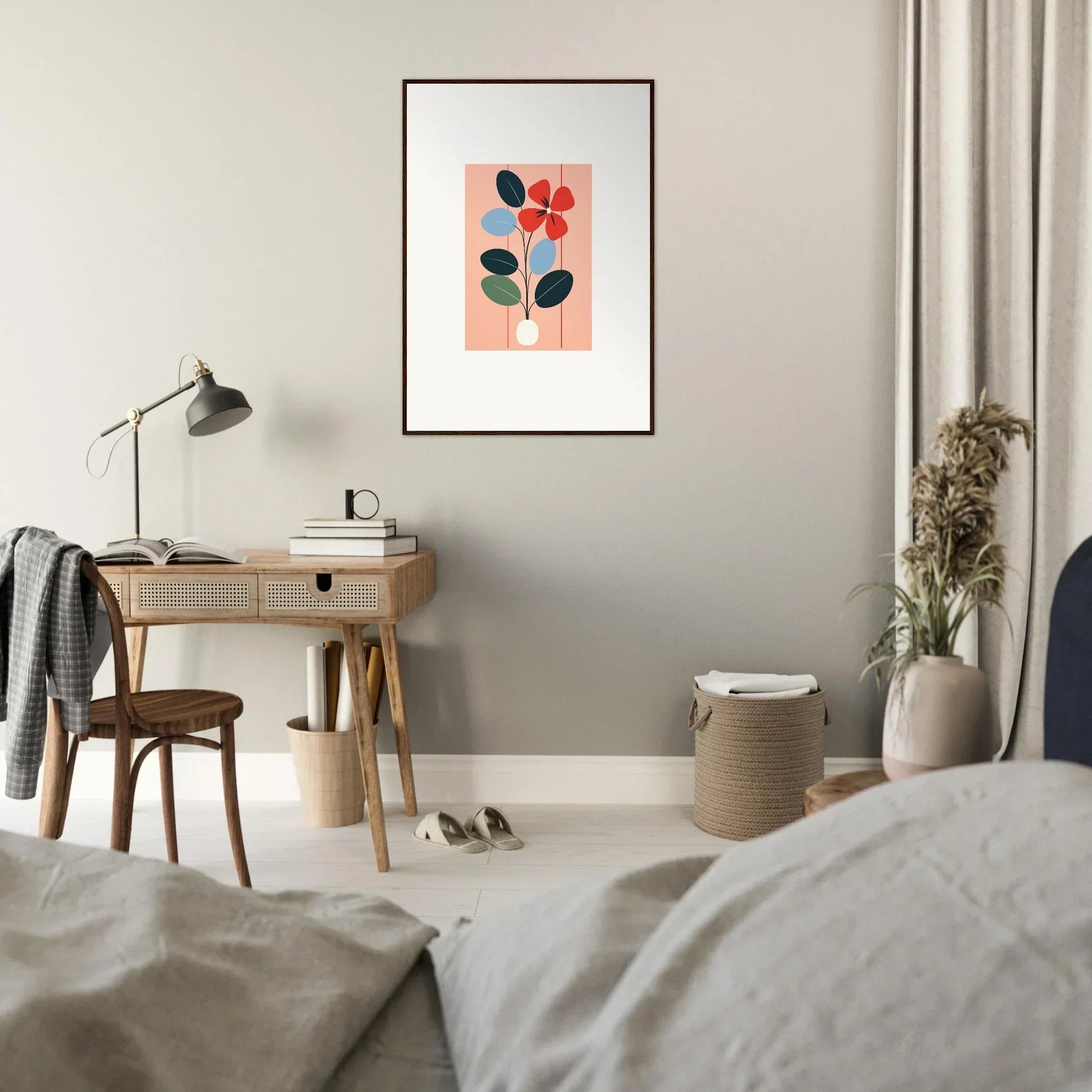 Framed wall art featuring abstract floral shapes on a pink background, perfect for room decor