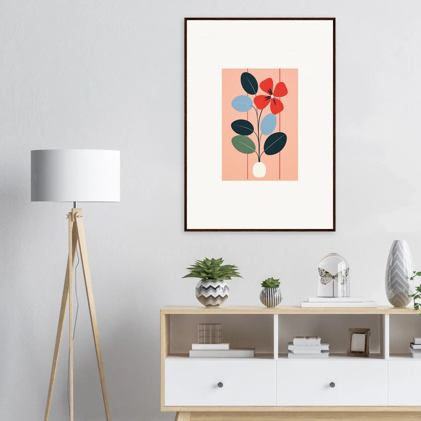 Framed wall art featuring minimalist flora imbibed with red and blue blooms on peach background