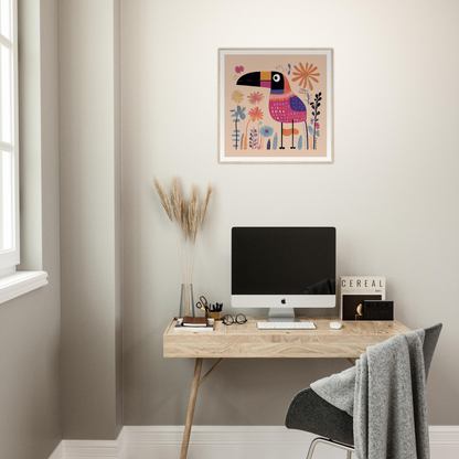 Minimalist wooden desk featuring an iMac and Paradise Feathers Quake toucan artwork