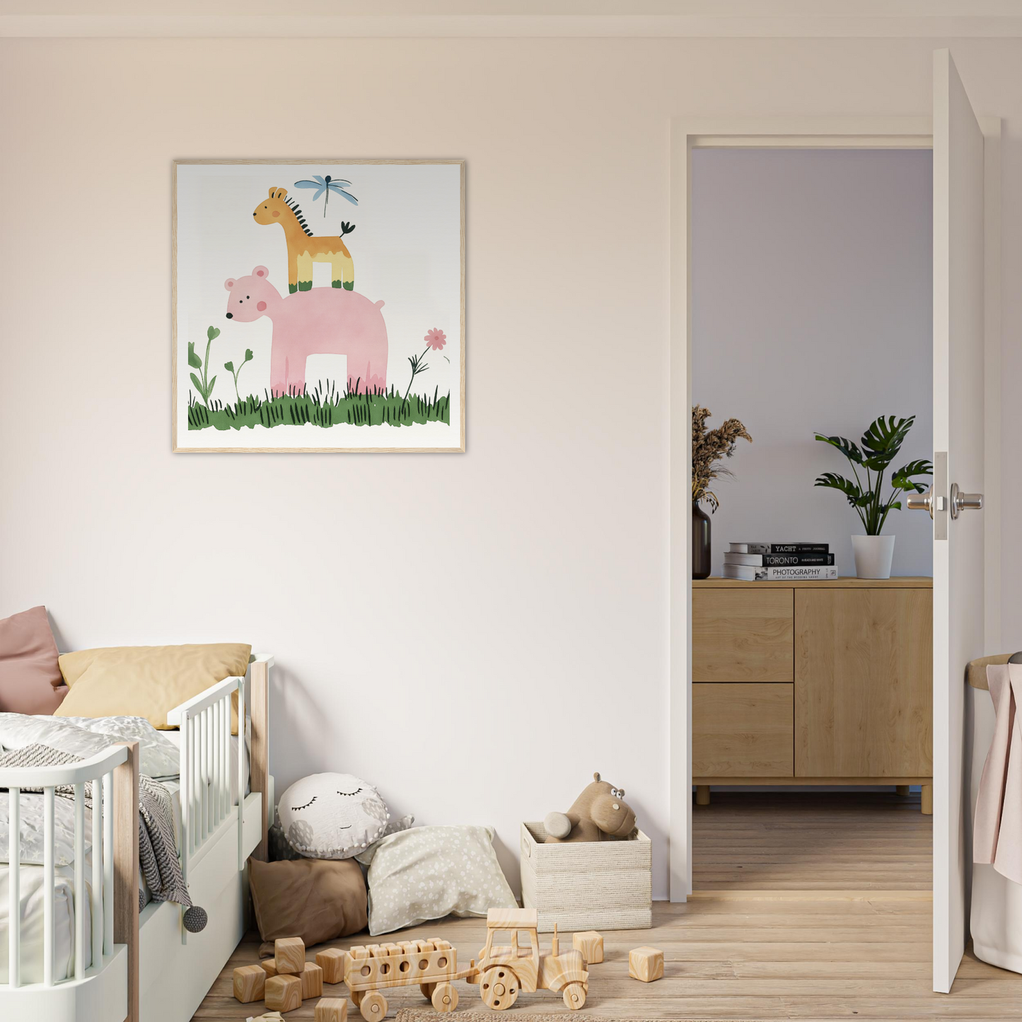 Framed nursery artwork showcasing giraffe atop pink elephant amidst flowers and grass