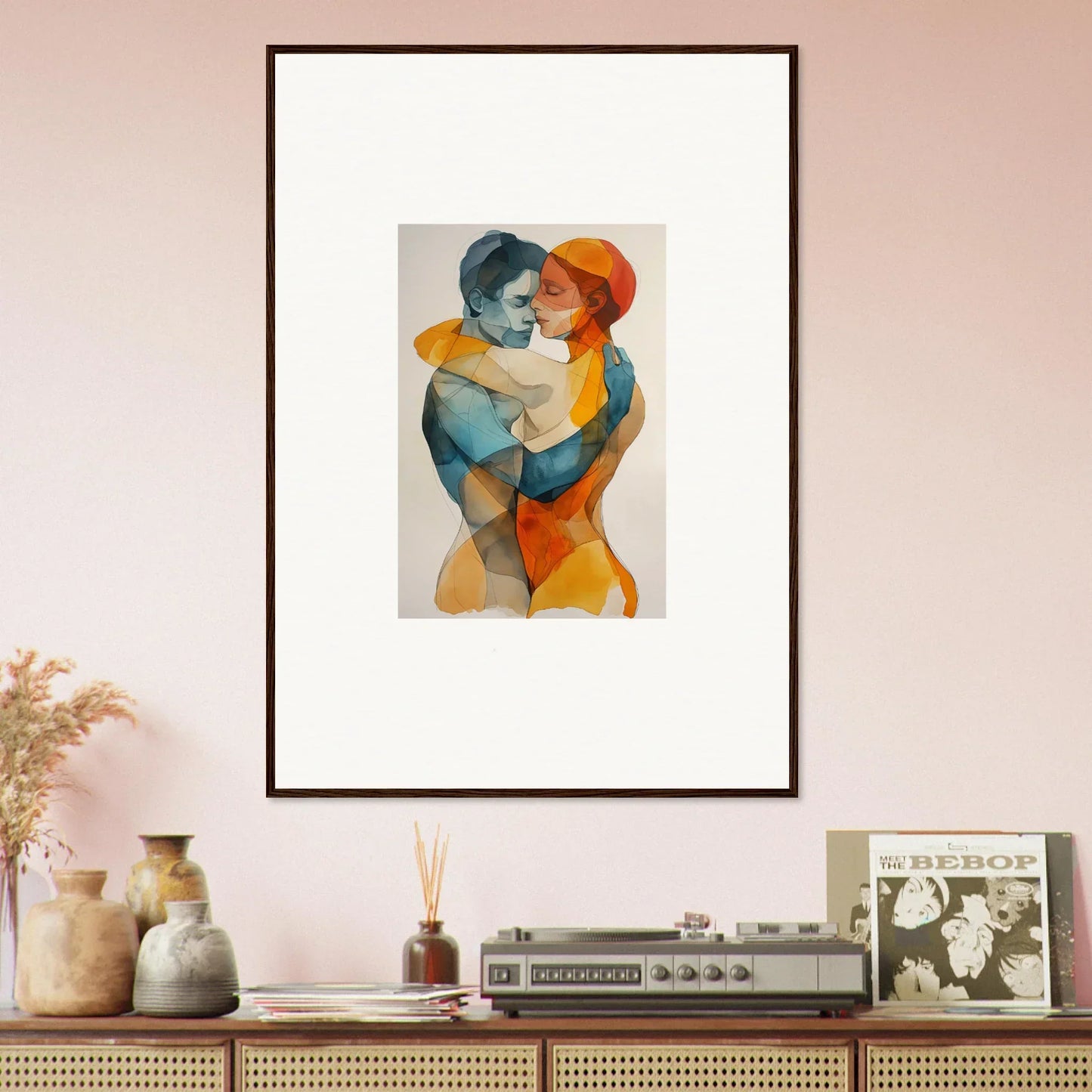 Framed abstract canvas print of embracing figures in blue and orange for room decoration