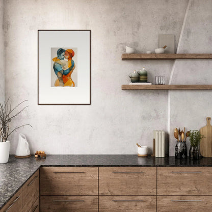 Framed abstract canvas print of two figures embracing in orange and blue for room decoration