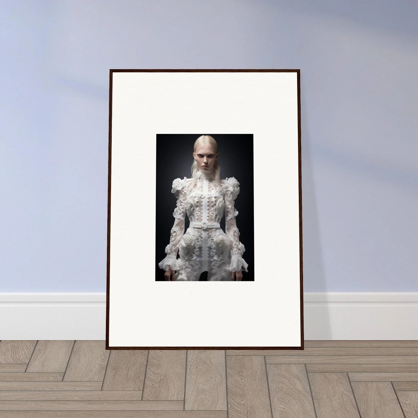 Framed black and white photograph of a person with a long beard wearing an ornate white dress.