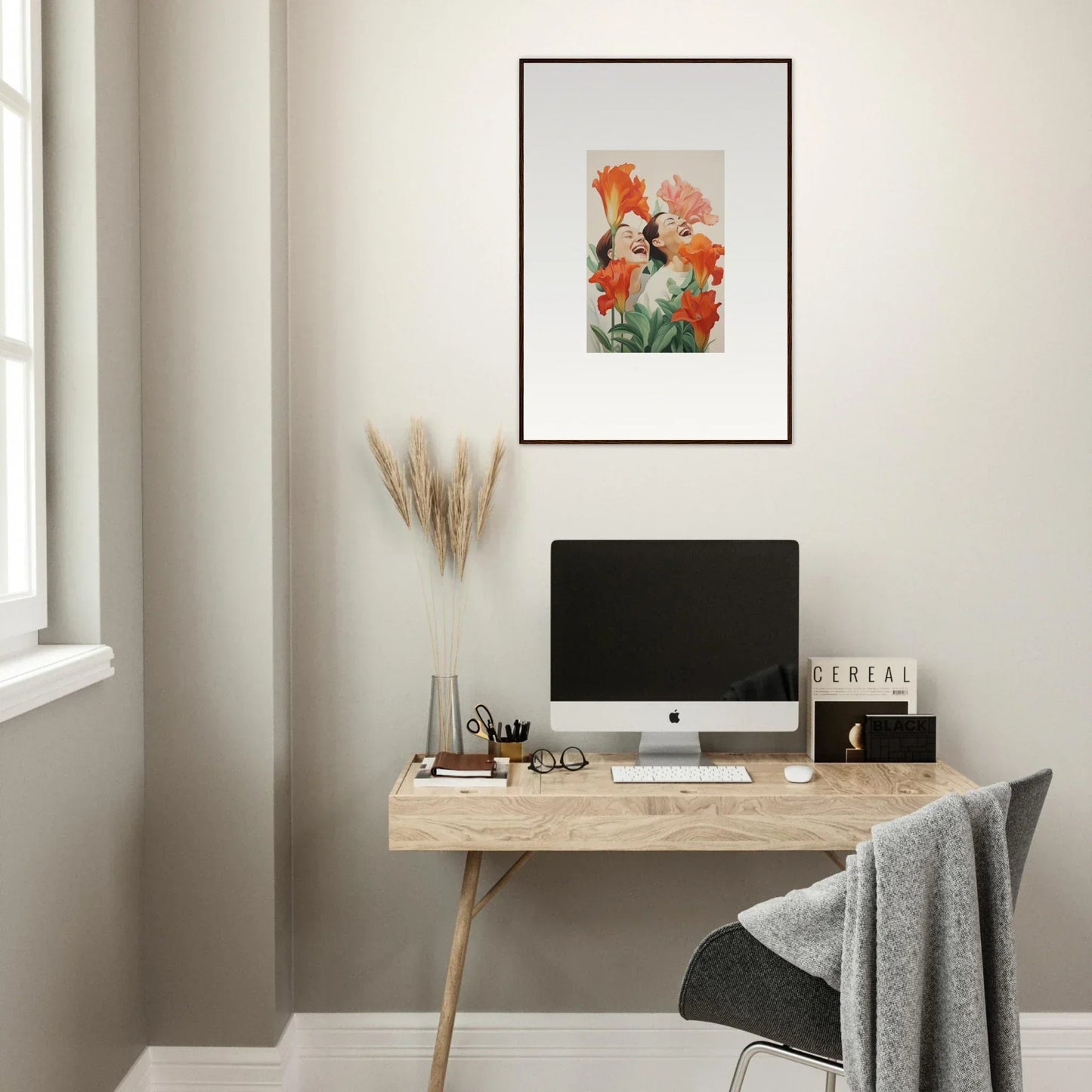 Minimalist wooden desk with a computer and Petal Laugh Brims canvas print above