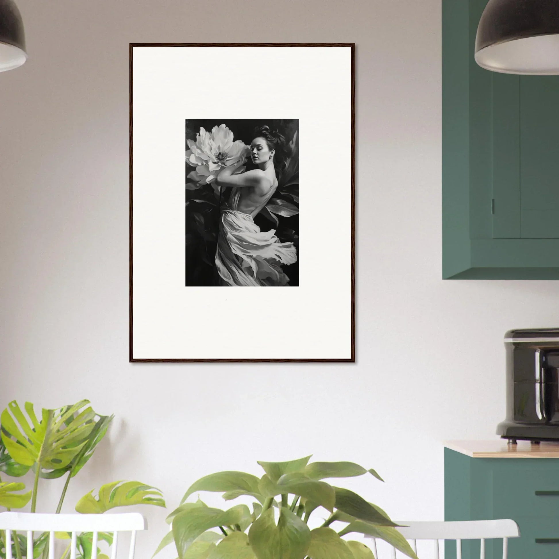 Framed black and white photograph of a person with a large flower for room decor