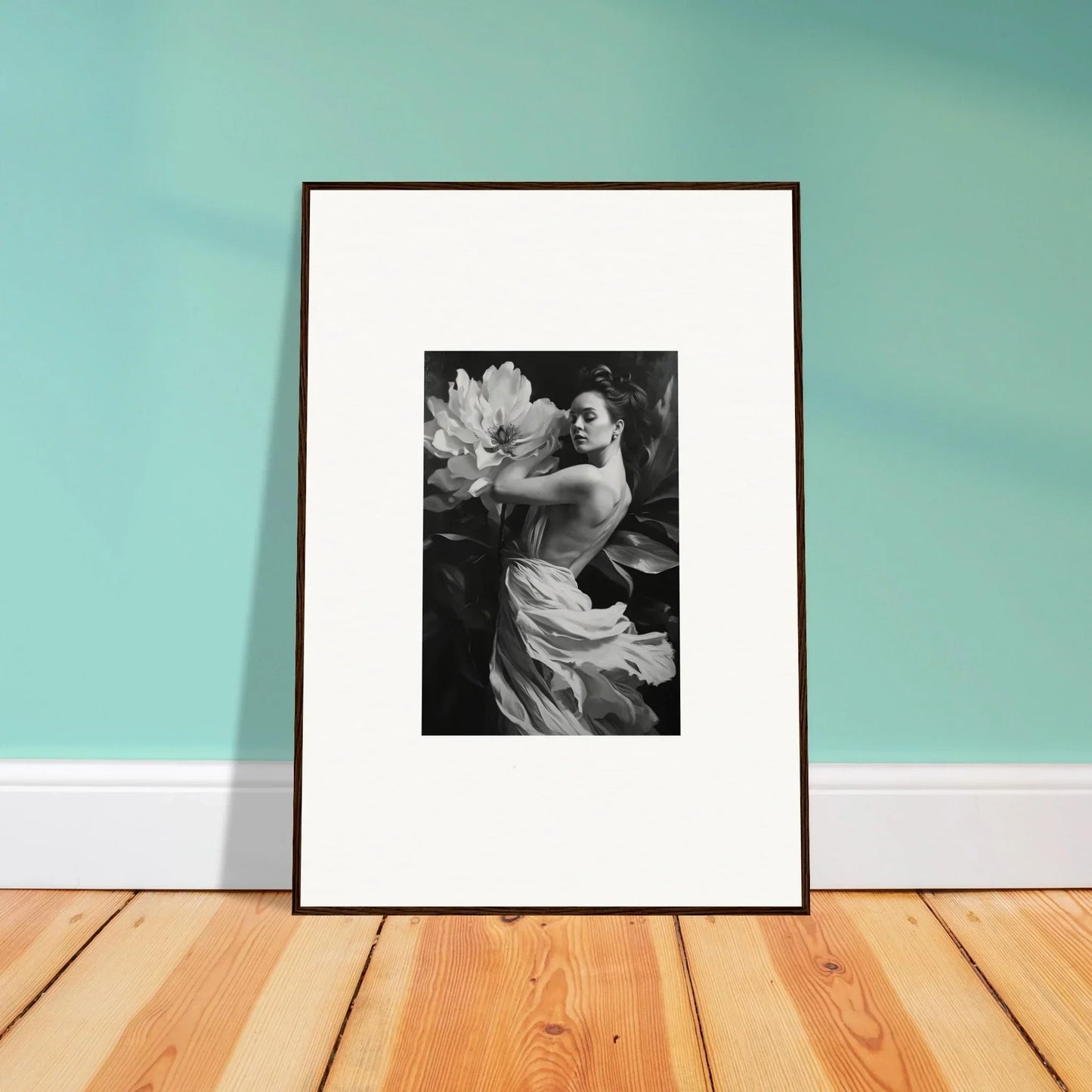 Framed black and white photograph of a person with flowers, ideal for room decor