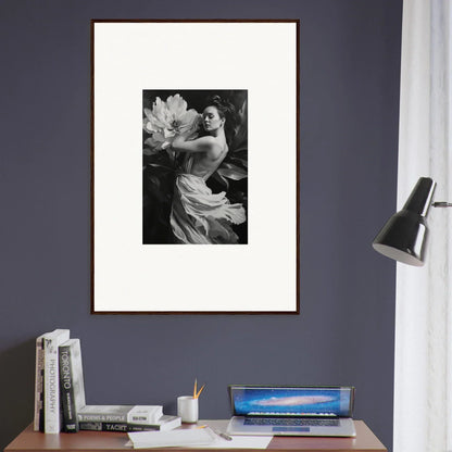 Framed black and white photograph of a person with large flowers for room decor