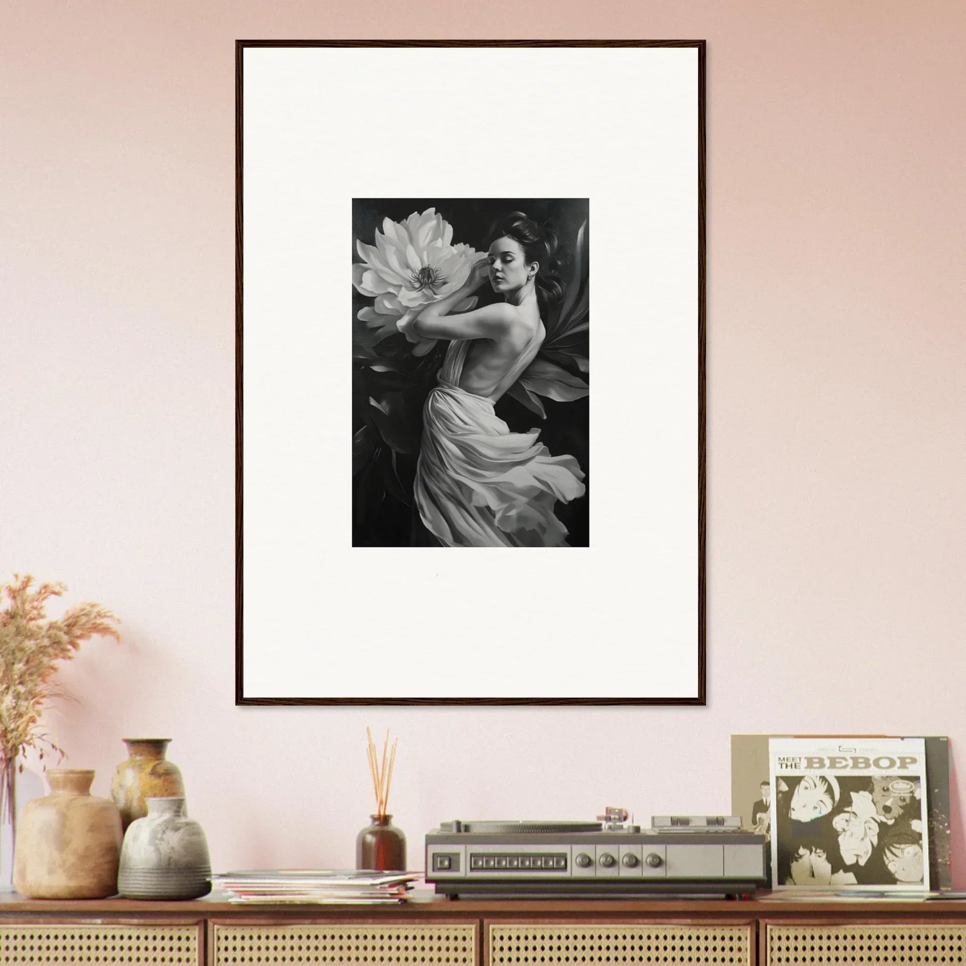 Framed black and white photograph of a person with a flower for elegant room decor