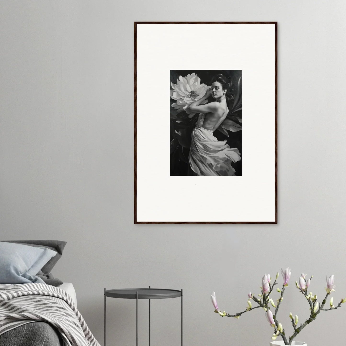 Framed black and white photograph of a person with a large flower for elegant room decor