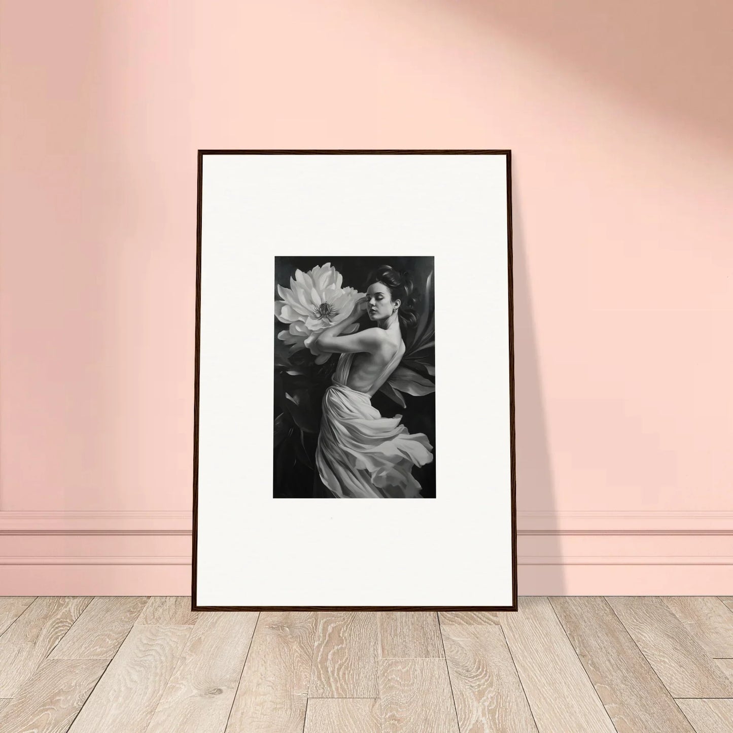 Framed black and white photograph of a person with a large flower for petal reverie room decor