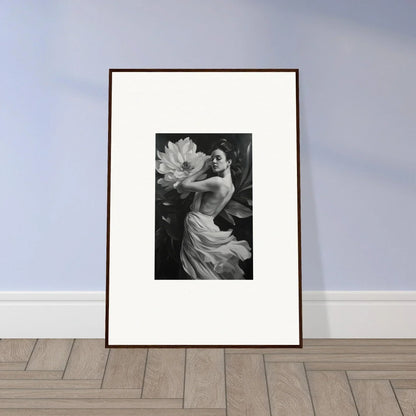 Framed black and white photograph of a figure with a flower for elegant room decor