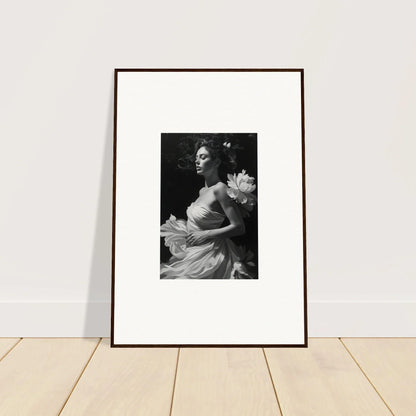 Framed black and white photo of a woman with flowers, perfect for room decoration