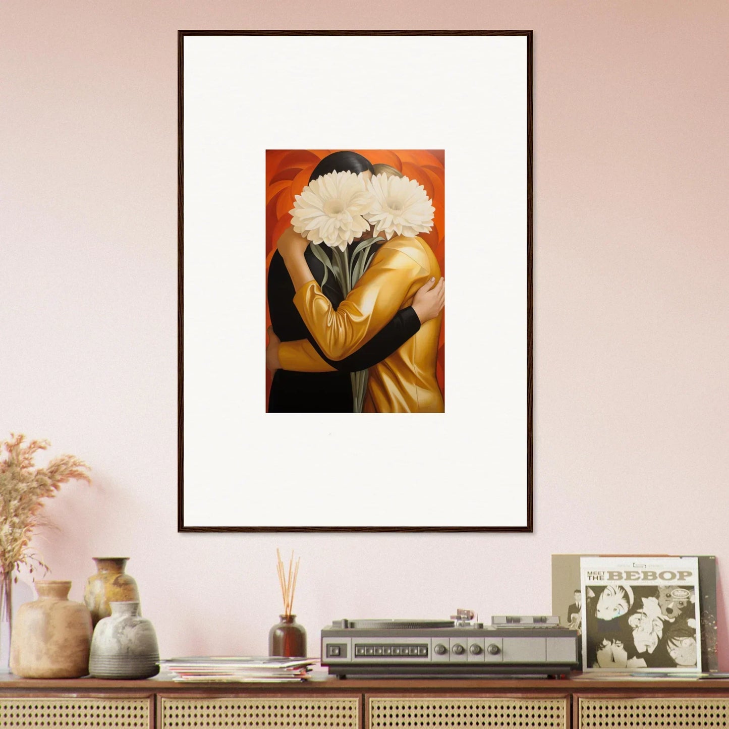 Framed wall art of a figure embracing white flowers on an orange background for room decor