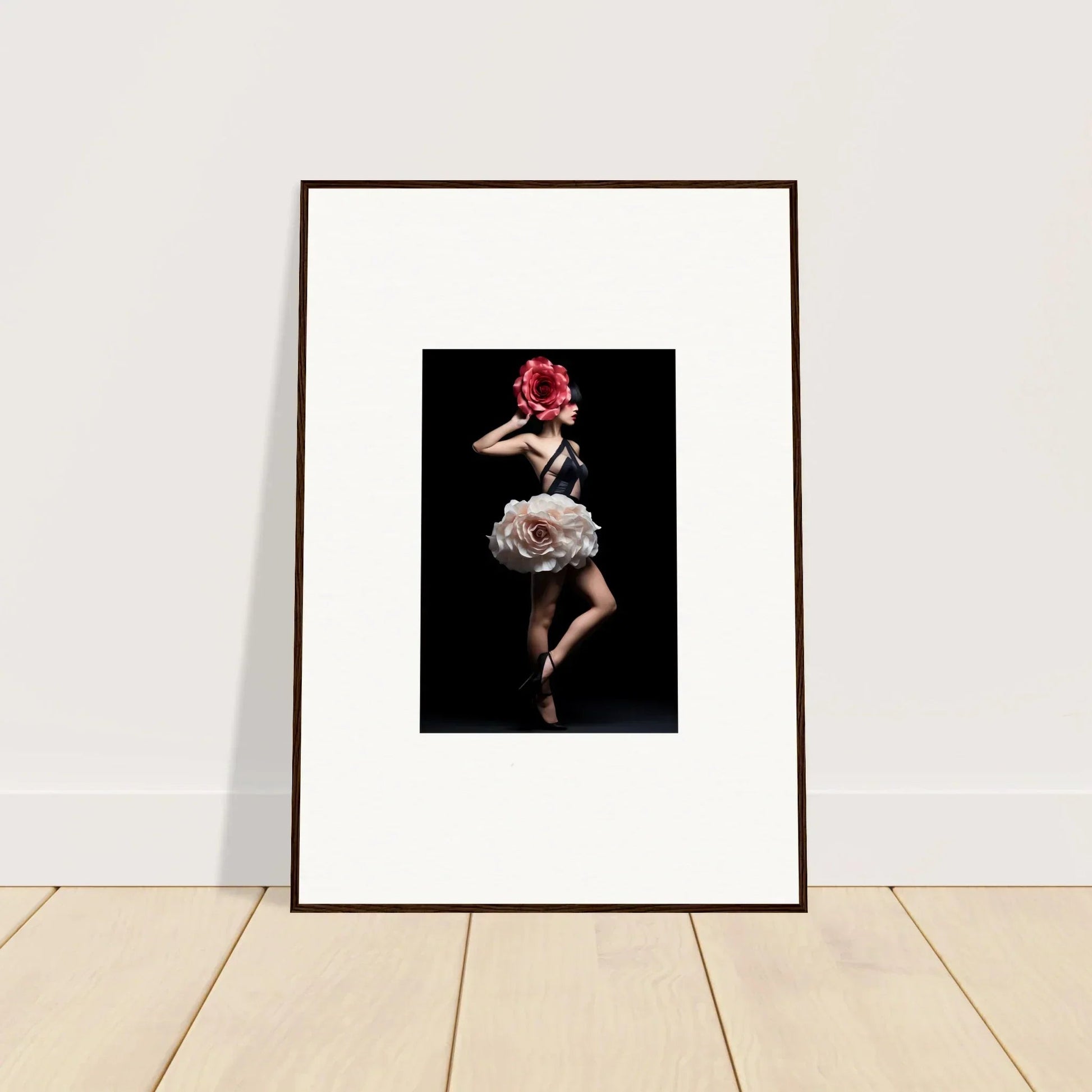 Framed photograph of a woman in a floral dress striking a dramatic pose against a dark background.