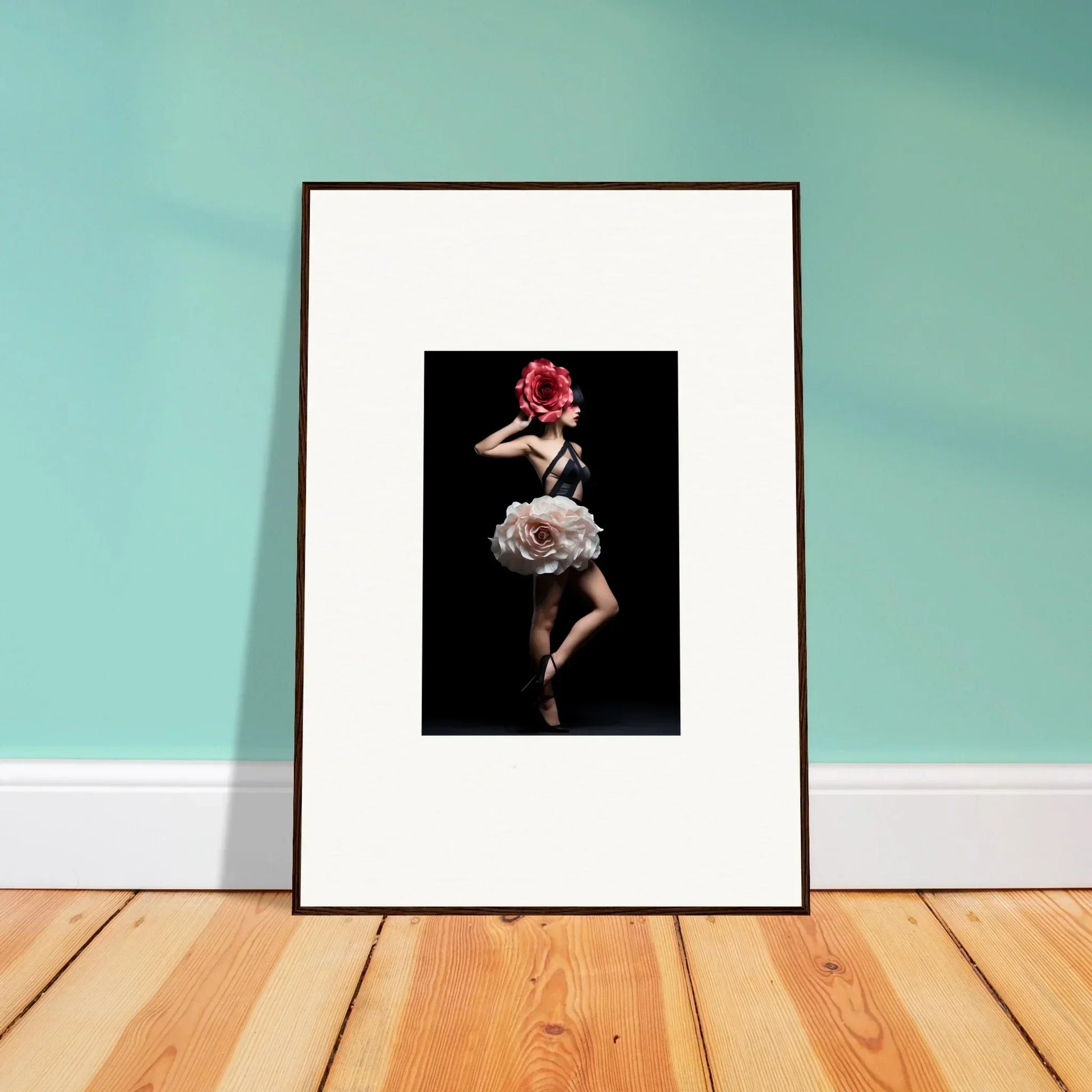 Framed photograph of a dancer in a white dress with a red flower headpiece.