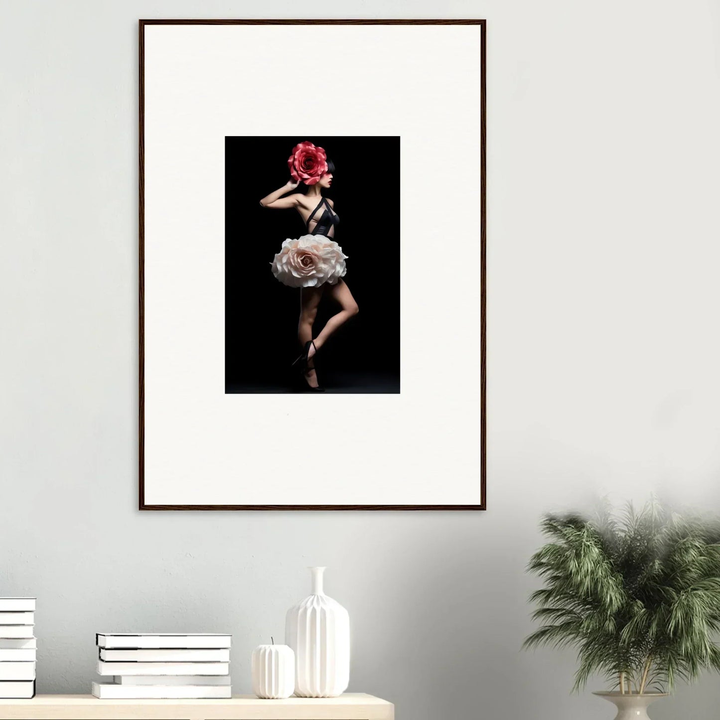 Framed photograph of a dancer in a dramatic pose wearing a red headpiece and flowing dress.