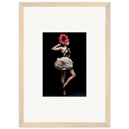 Framed photograph of a dancer wearing a floral-inspired costume against a dark background.