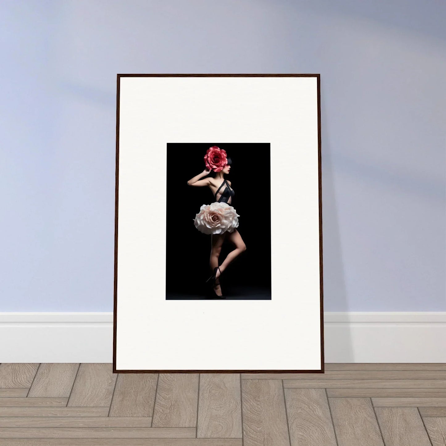 Framed photograph of a dancer in a dramatic pose wearing a floral headpiece.