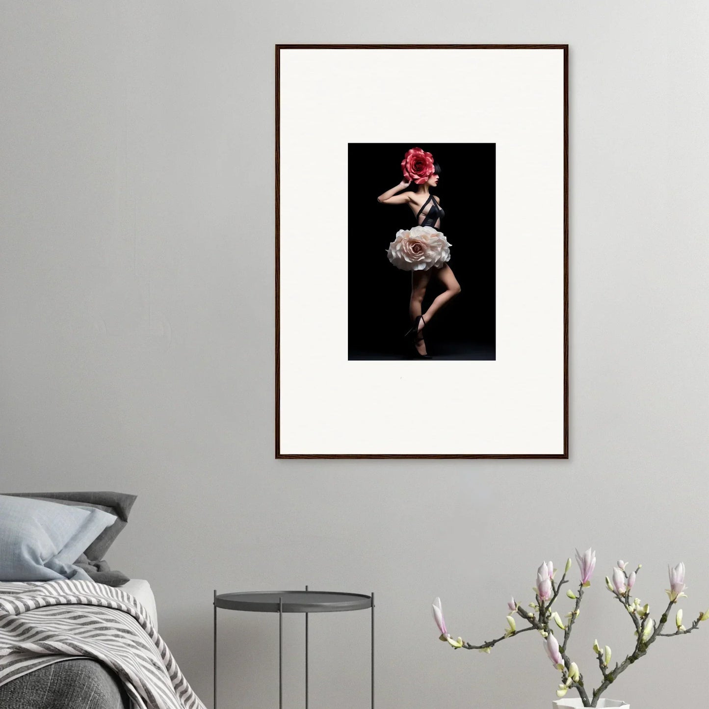 Framed photograph of a dancer in a dramatic pose with a red flower.