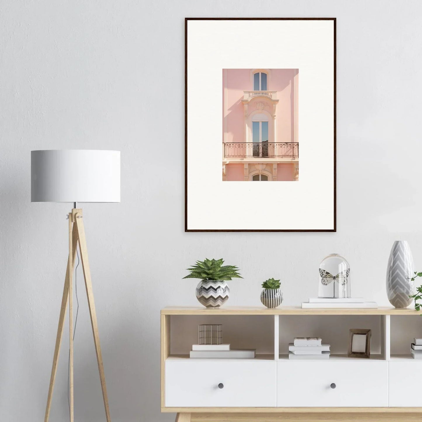 Framed wall art of a charming pink building in the Pink Echoed Dream collection