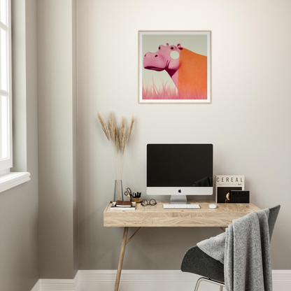 Minimalist wooden desk with iMac and artwork, featuring Pink Hippopoetry Buzz decor