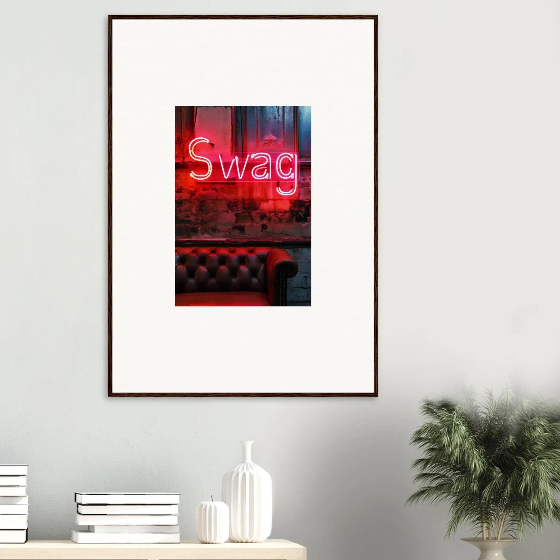 Framed neon Swag sign above a leather couch, perfect for room decoration and wall art