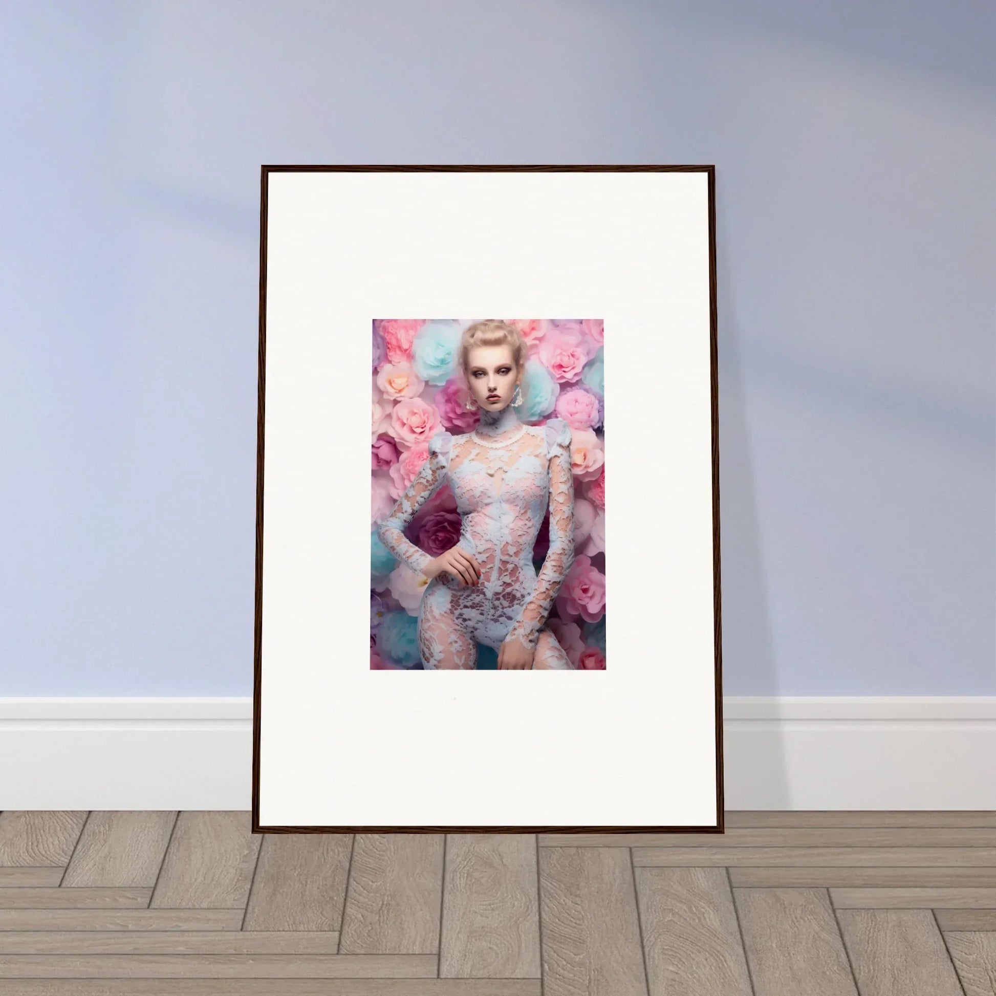 Framed artwork featuring a portrait surrounded by pink floral elements.