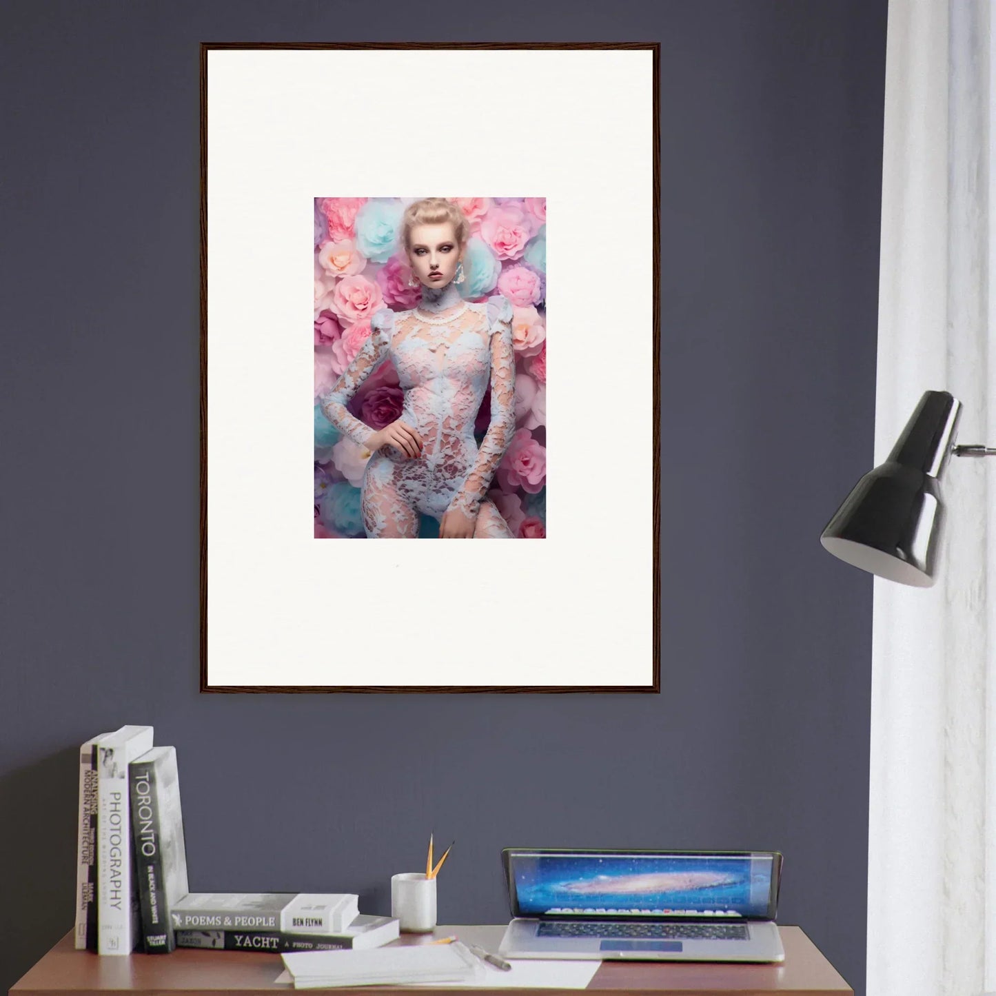 Framed artwork featuring a figure surrounded by pink flowers against a pastel background.