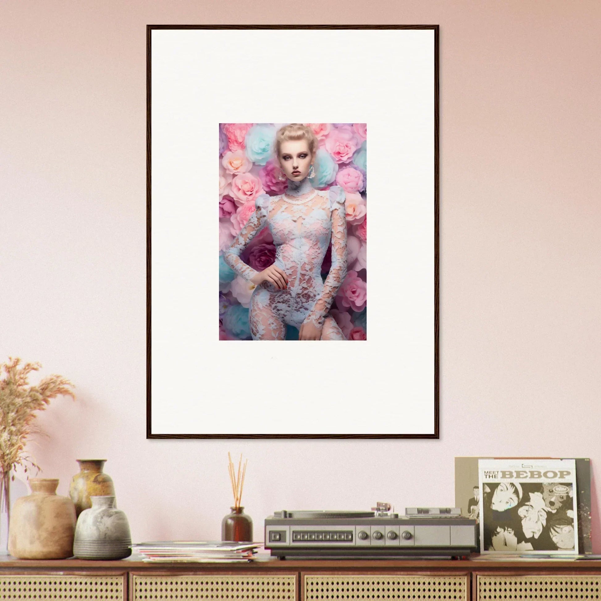 Framed portrait of a person surrounded by pink and blue floral elements.