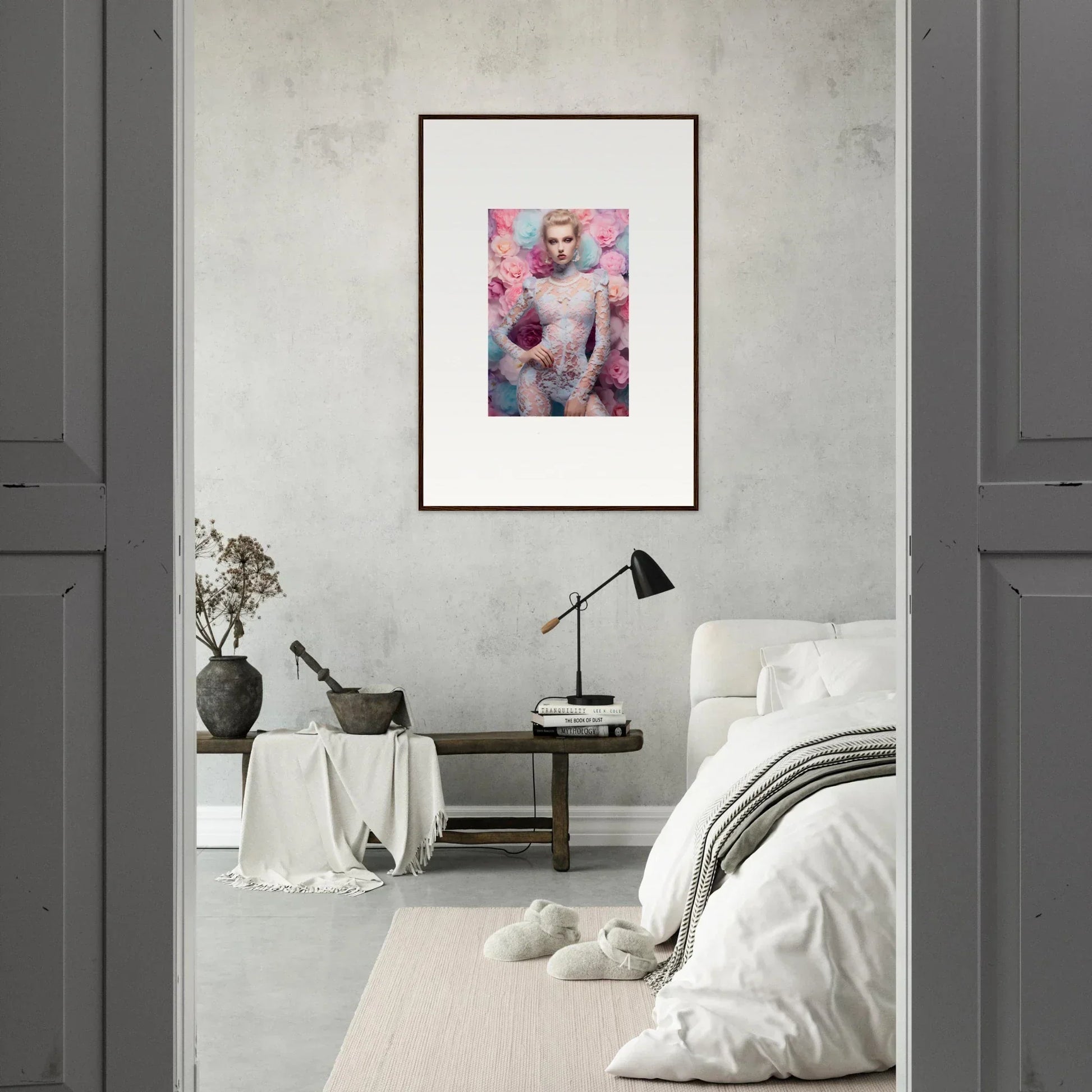 Framed artwork depicting a nude figure surrounded by pink floral elements.