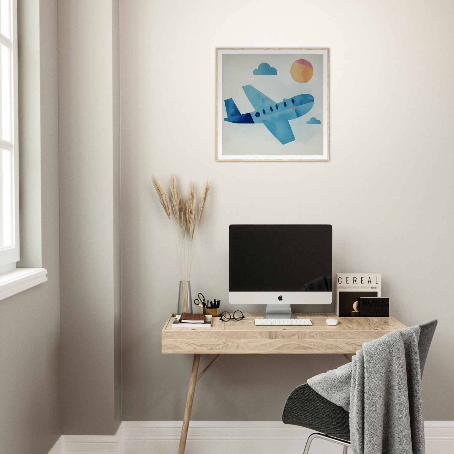 Simple wooden desk with iMac, perfect for a stylish nursery decor setup